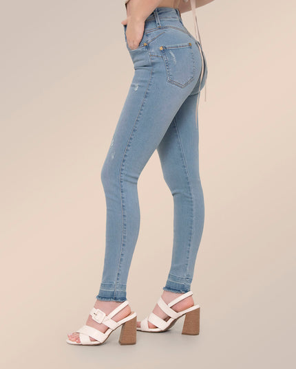 Jean Skinny claro con detalles desgastados