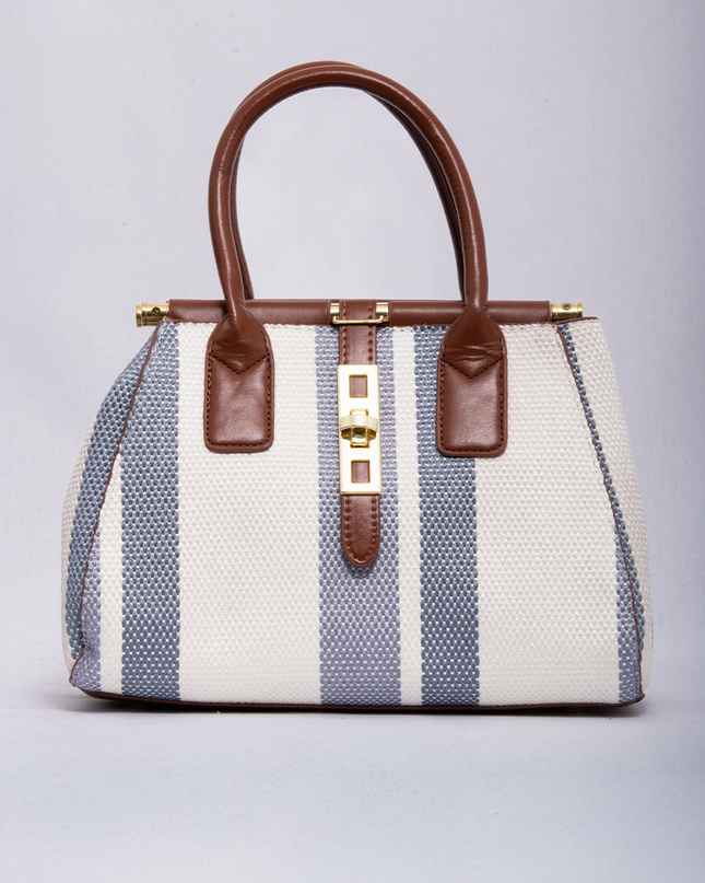 Bolso tipo bucket en lona rayada con herrajes metálicos
