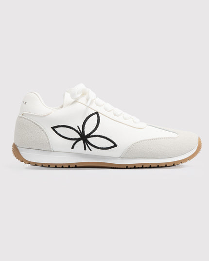 Zapatillas blancas con bordado floral contrastante