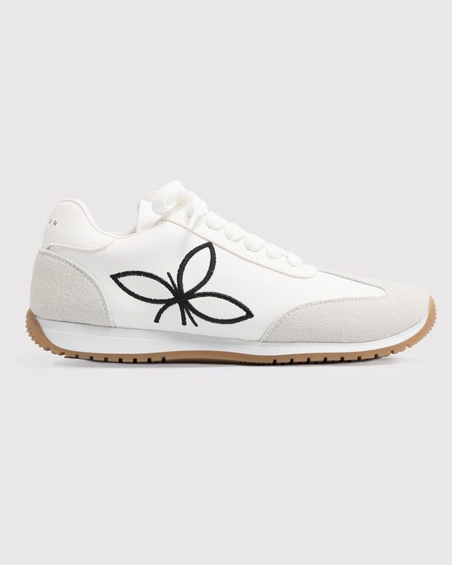 Zapatillas blancas con bordado floral contrastante
