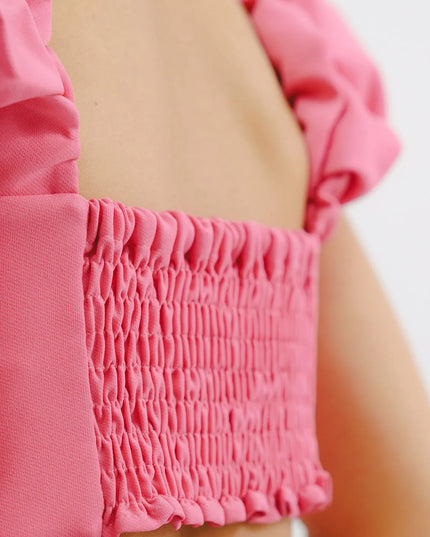 Croptop rosado con tiras enresortadas